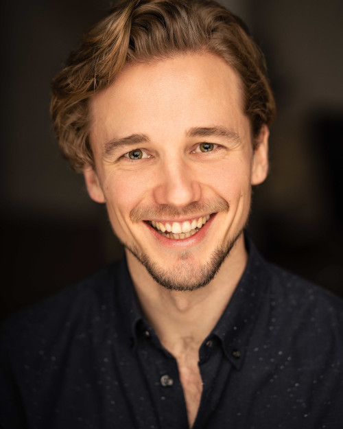 Headshot by Sam Mackay